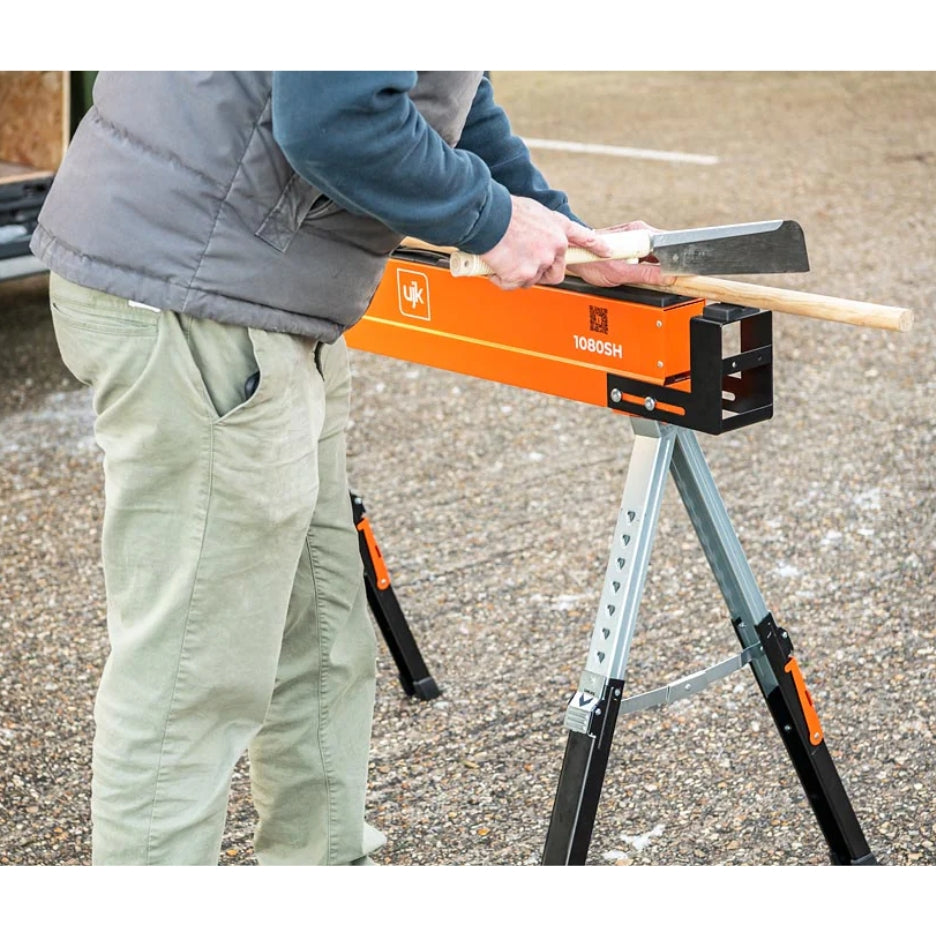 Person working on wood on top of UJK Tools Sawhorses