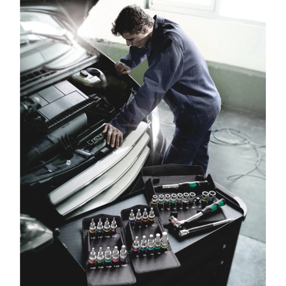 Man looking at car's engine