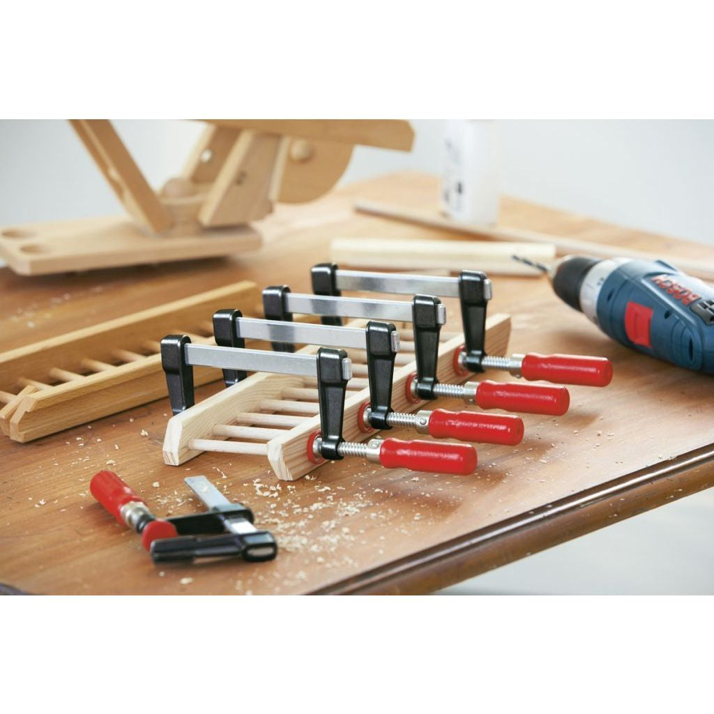Bessey 330 Pound Lightweight F-Clamps helping with assembly of wooden structure