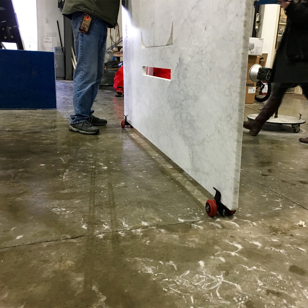 A granite countertop is supported by two Clip N Roll units.