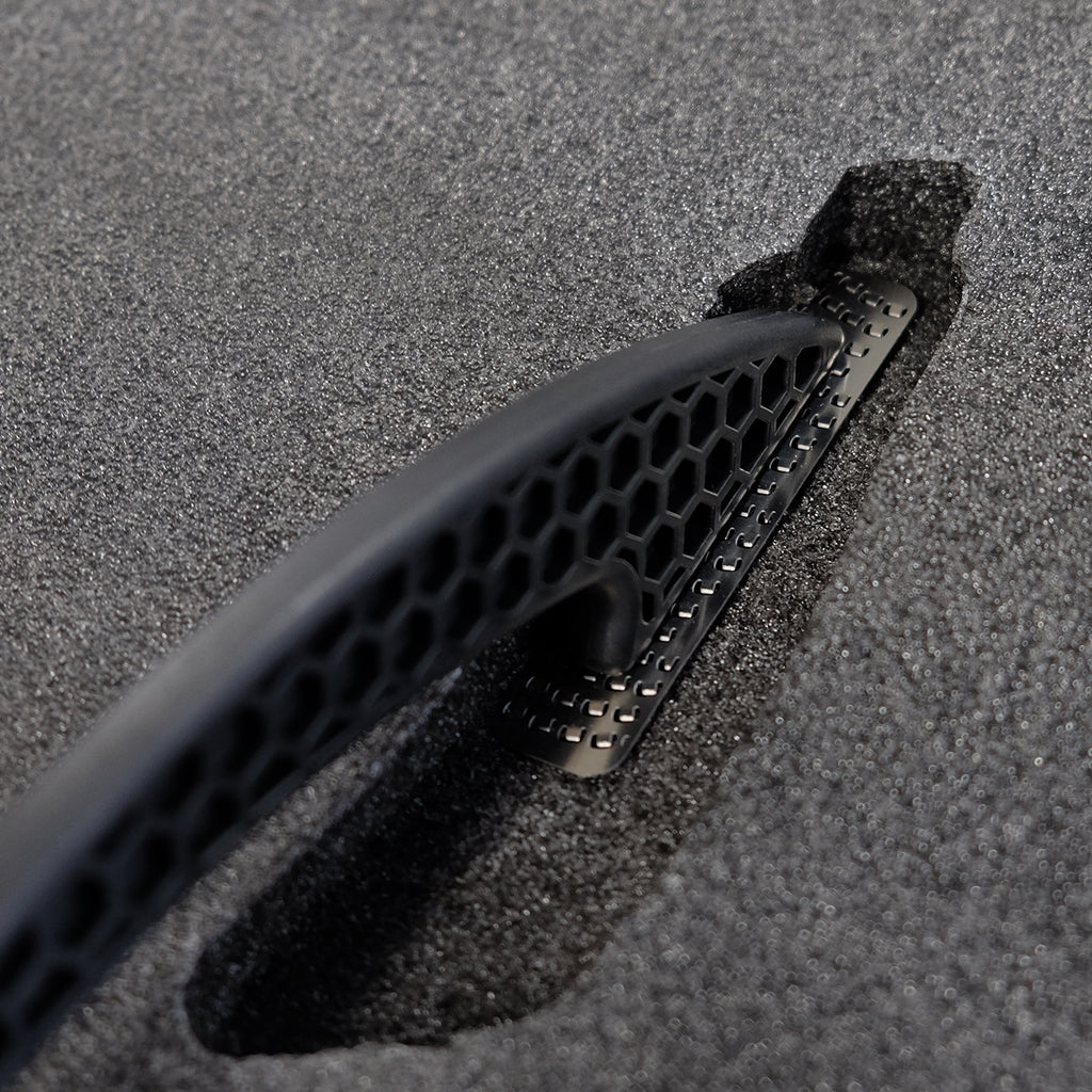 The Kaizen Foam Scraper is being used to flatten the bottom of a cutout for a knife.