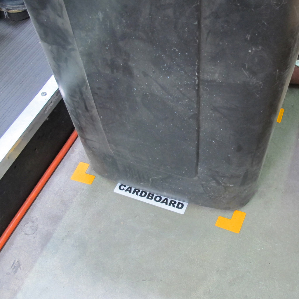 Large Kaizen Korners clearly indicate where a cardboard recycling bin belongs.