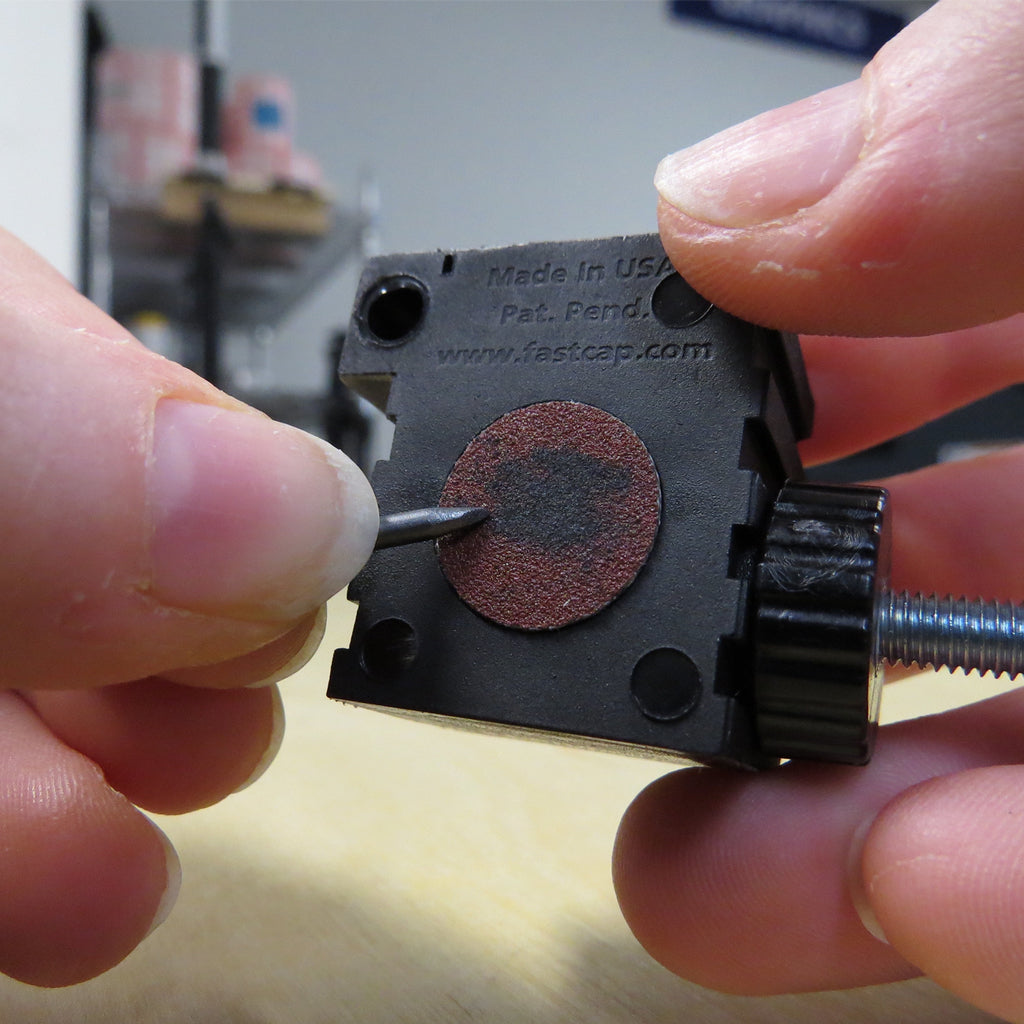 An abrasive disc on the side of the Mini Scribe provides a convenient place to sharpen a pencil lead.