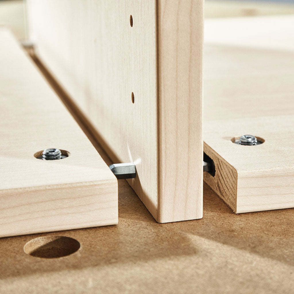 Using the Centre Panel Connectors to attach two horizontal cabinet components through a vertical gable.