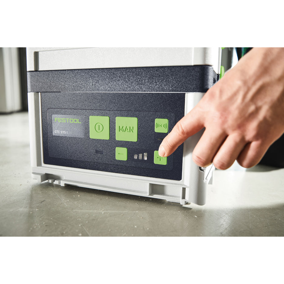 Worker presses the plus button to increase the suction level of the CTC SYS Dust Extractor.