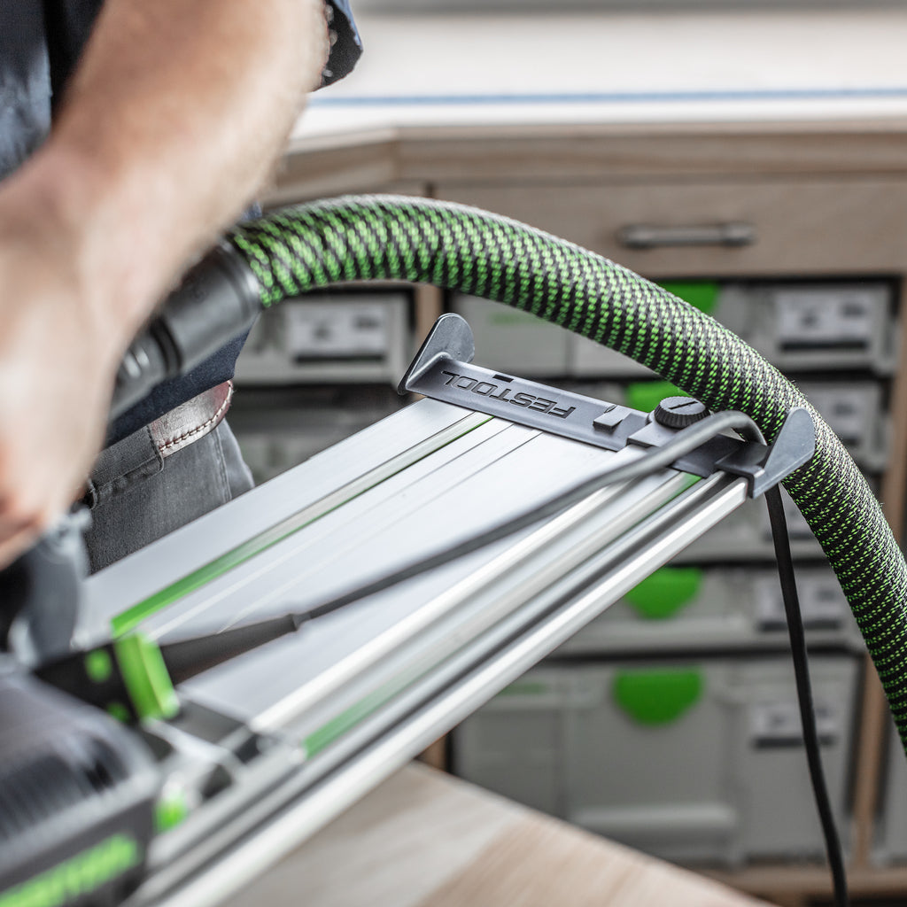 Blue plastic Festool guide rail deflector allows a hose and power cord to slide easily over the end of the aluminum track.