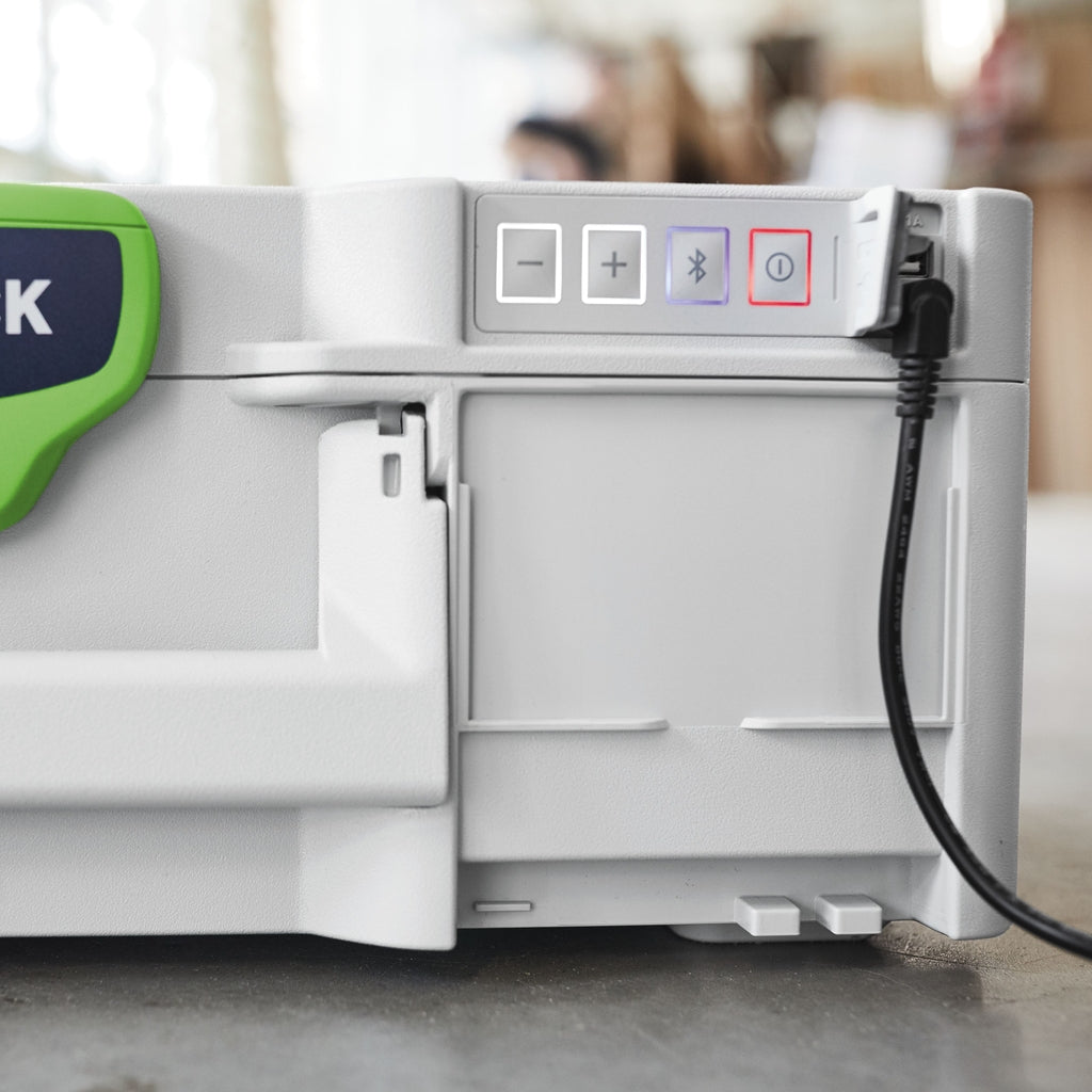 Volume, Bluetooth, and power buttons are illuminated at front right of Festool TopRock speaker. USB port behind cover.