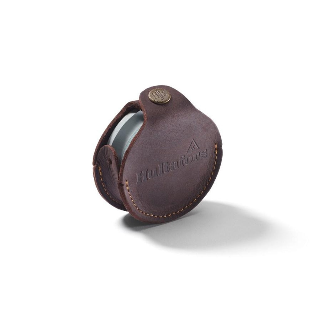 Hultafors double-sided 180/600 grit axe sharpening stone in leather case with snap closure.