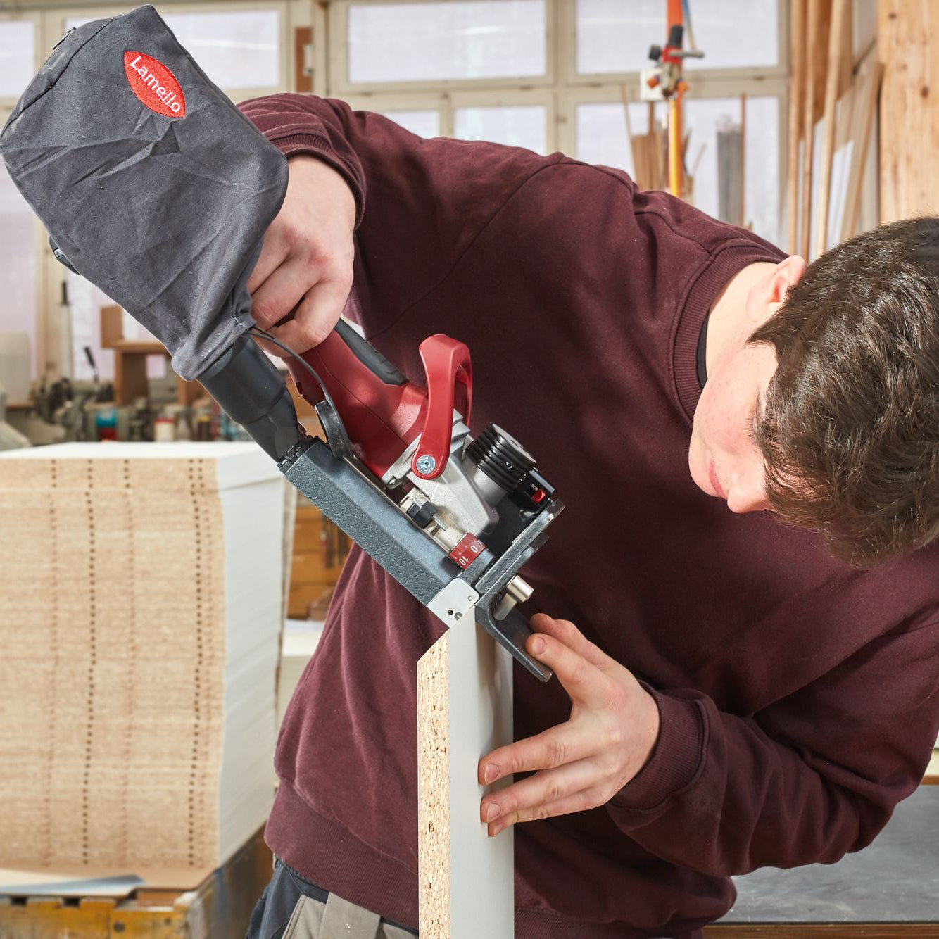 Lamello Zeta P2 Cordless Biscuit Joiner cutting slot in mitred melamine particle board