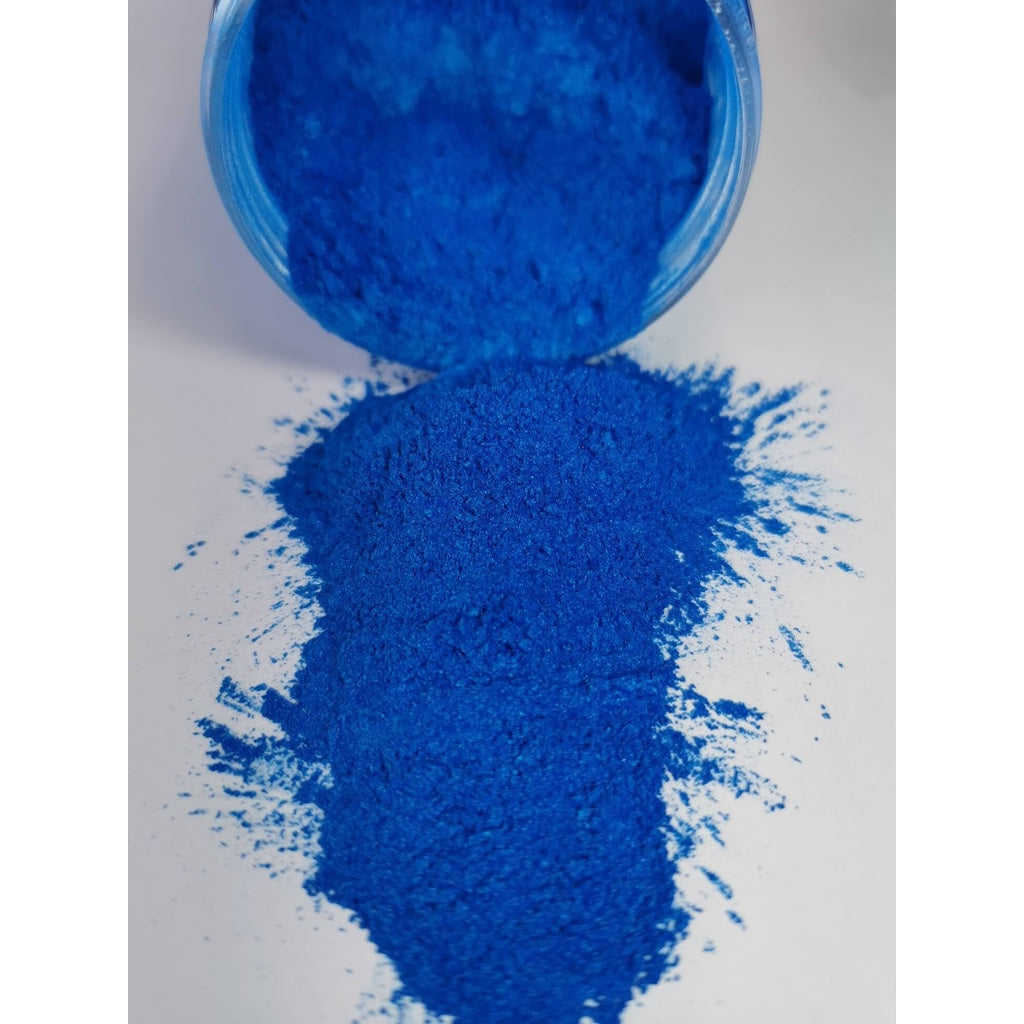 A jar of Blue Sky Ryver Epoxy Aurora Metallic Pigment on its side showing the actual colour and consistency of mica.