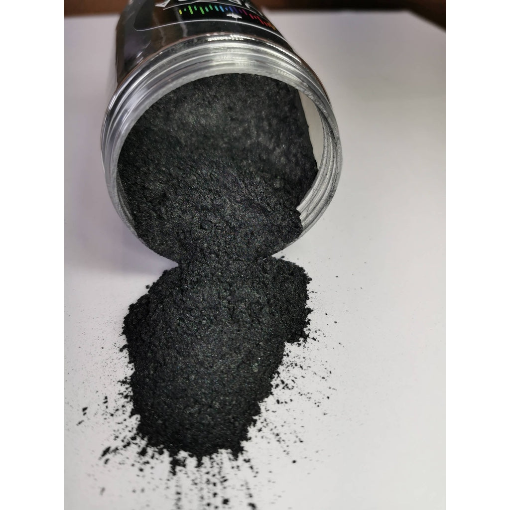 A jar of Dirty Grey Ryver Epoxy Aurora Metallic Pigment on its side showing the actual colour and consistency of mica.