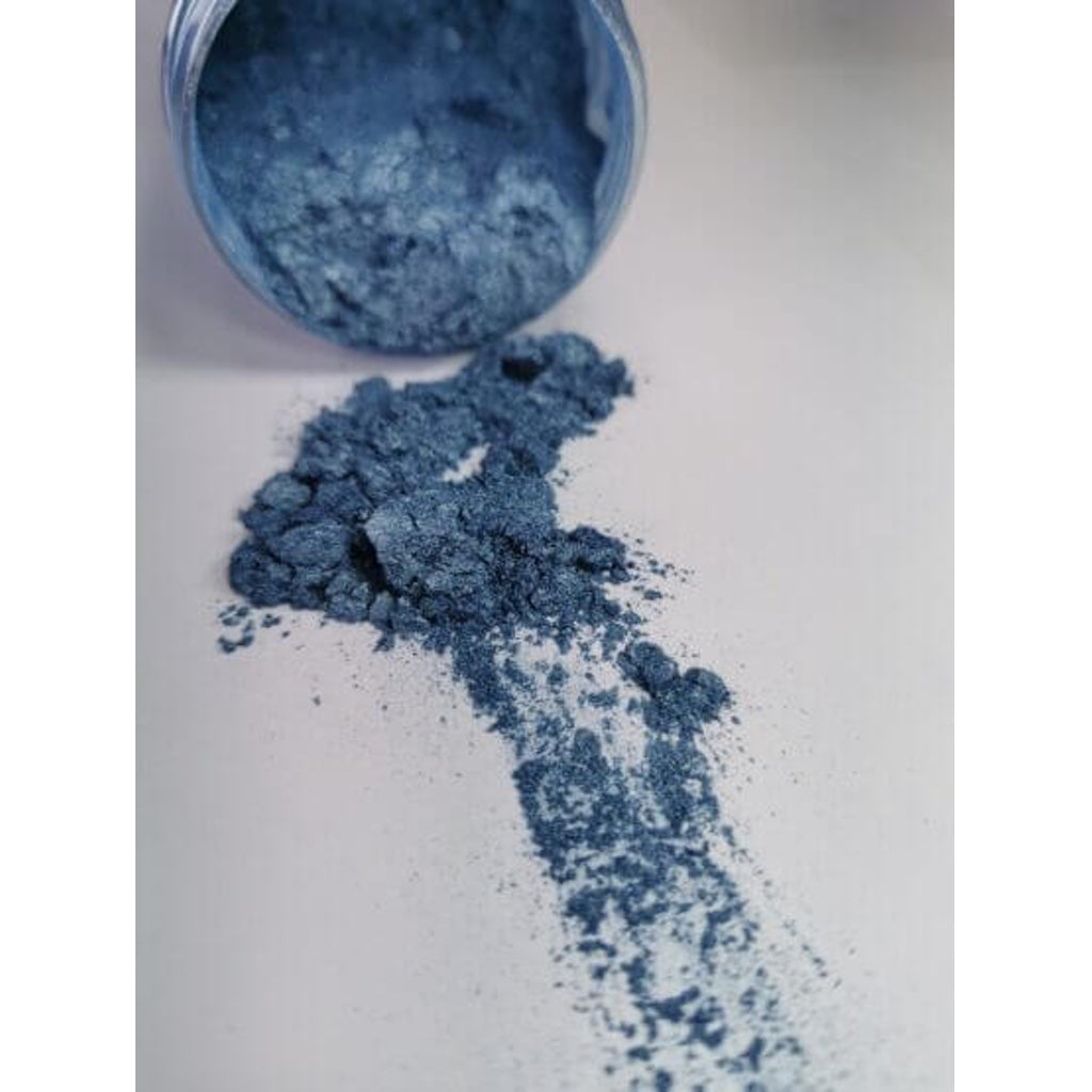 A jar of English Sky Ryver Epoxy Aurora Metallic Pigment on its side showing the actual colour and consistency of mica.
