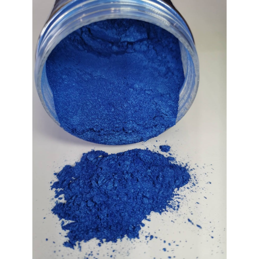 A jar of Marine Blue Ryver Epoxy Aurora Metallic Pigment on its side showing the actual colour and consistency of mica.