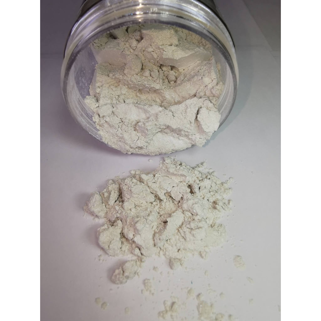 A jar of Ocean Pearl Ryver Epoxy Aurora Metallic Pigment on its side showing the actual colour and consistency of mica.