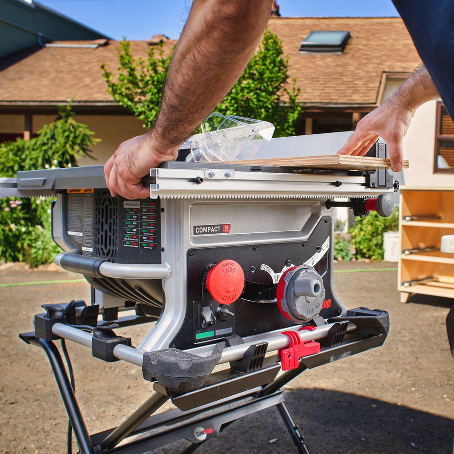 Woodworker rips a small piece of plywood on SawStop Compact Table Saw.