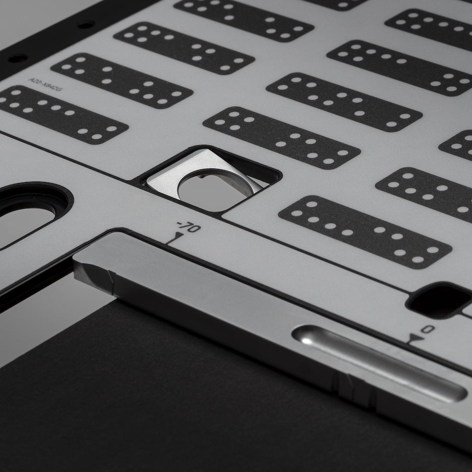 One of four flag stops flipped down to register Plate perpendicular against the workpiece.