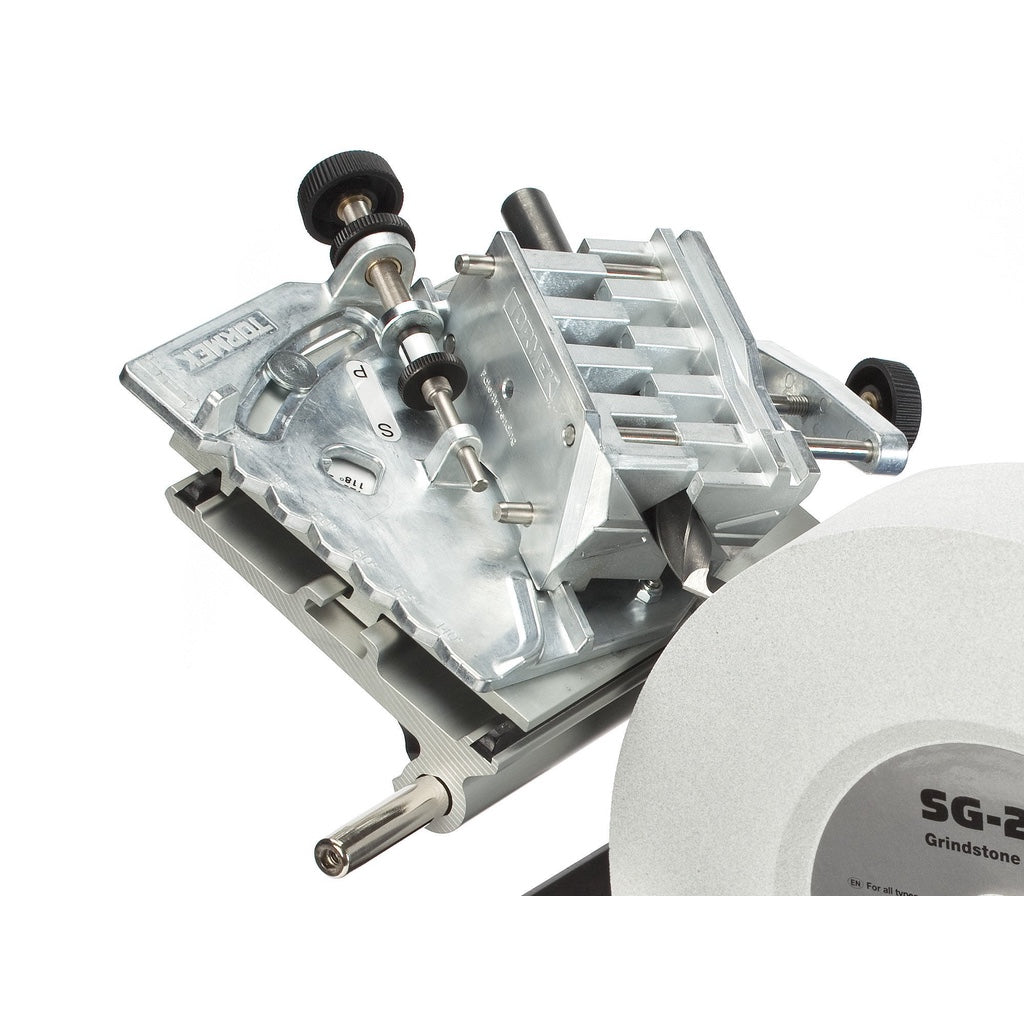 A twist drill bit is installed in the Tormek DBS 22 Drill Bit Sharpening Attachment for grinding.