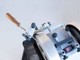 This setup allows the sharpening jig to reach around the stone and sharpen on the outside face.