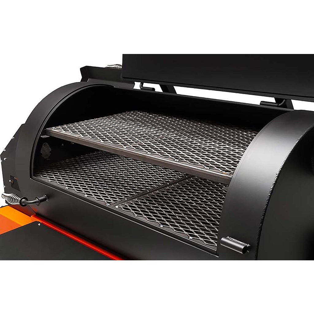 Food compartment lid open, showing pull-out second shelf and main grill of the Yoder Smokers YS1500S Pellet Grill.
