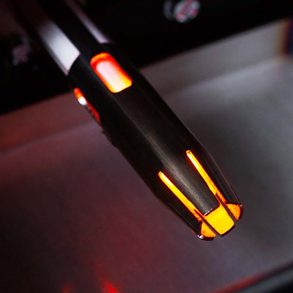 The ceramic igniter is shielded by a metal shroud for protection.