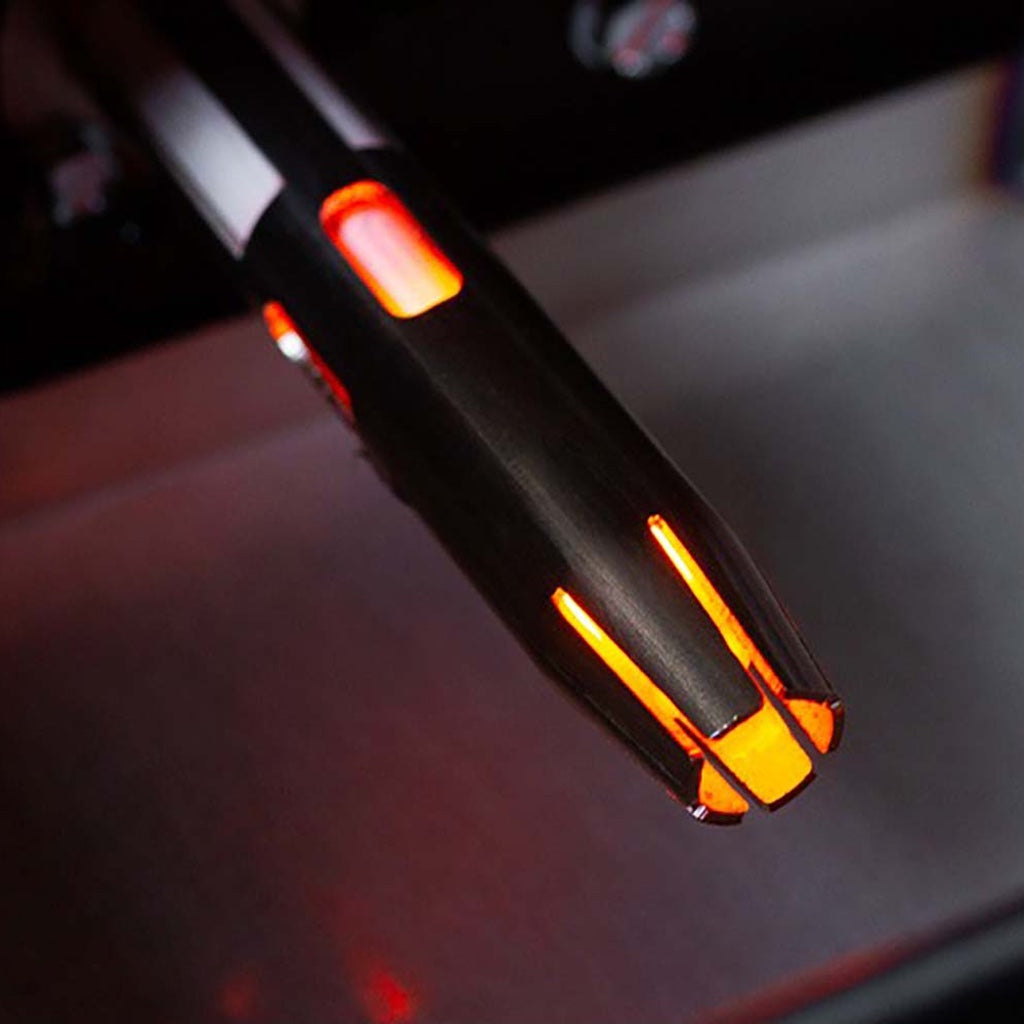 The ceramic igniter is shielded by a metal shroud for protection.