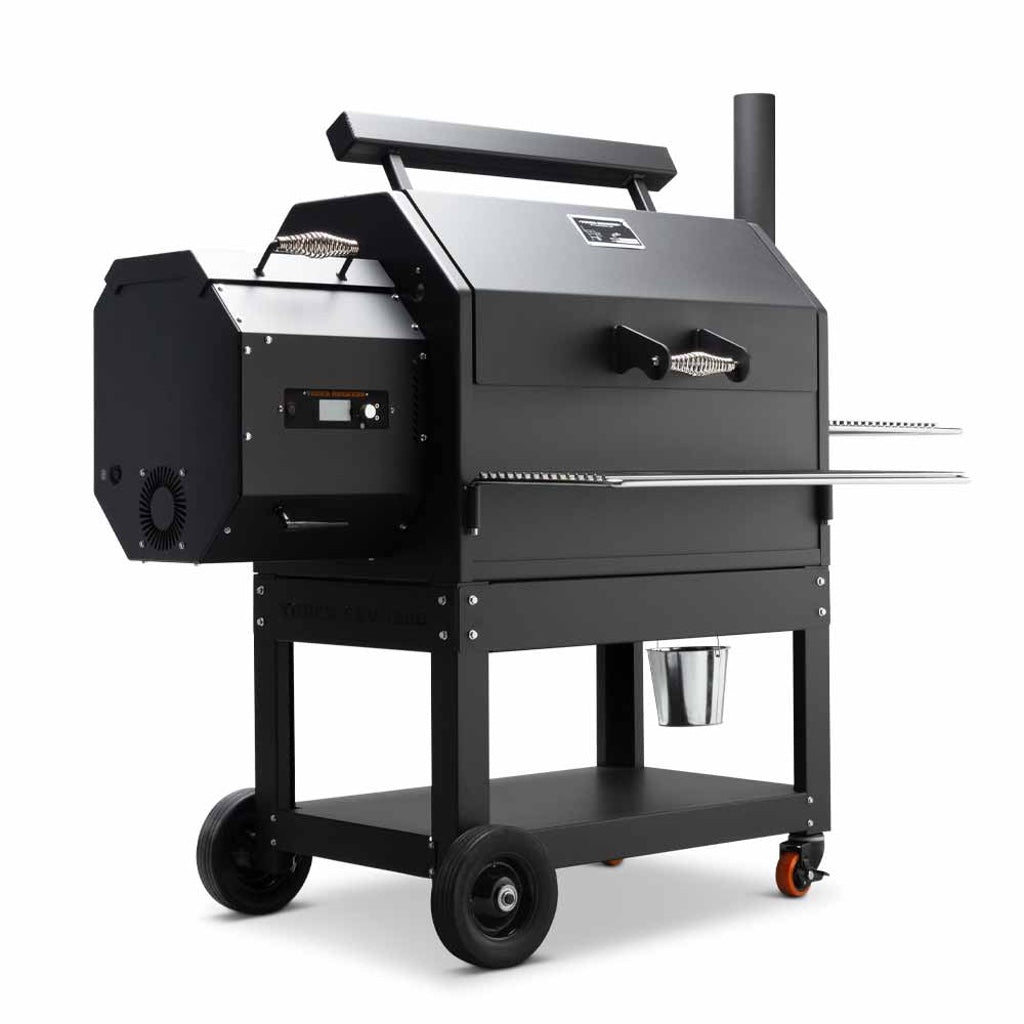 Front left view of Yoder Smokers YS640S Pellet Grill. Pellet hopper with controls, wheeled steel stand, wire shelves.