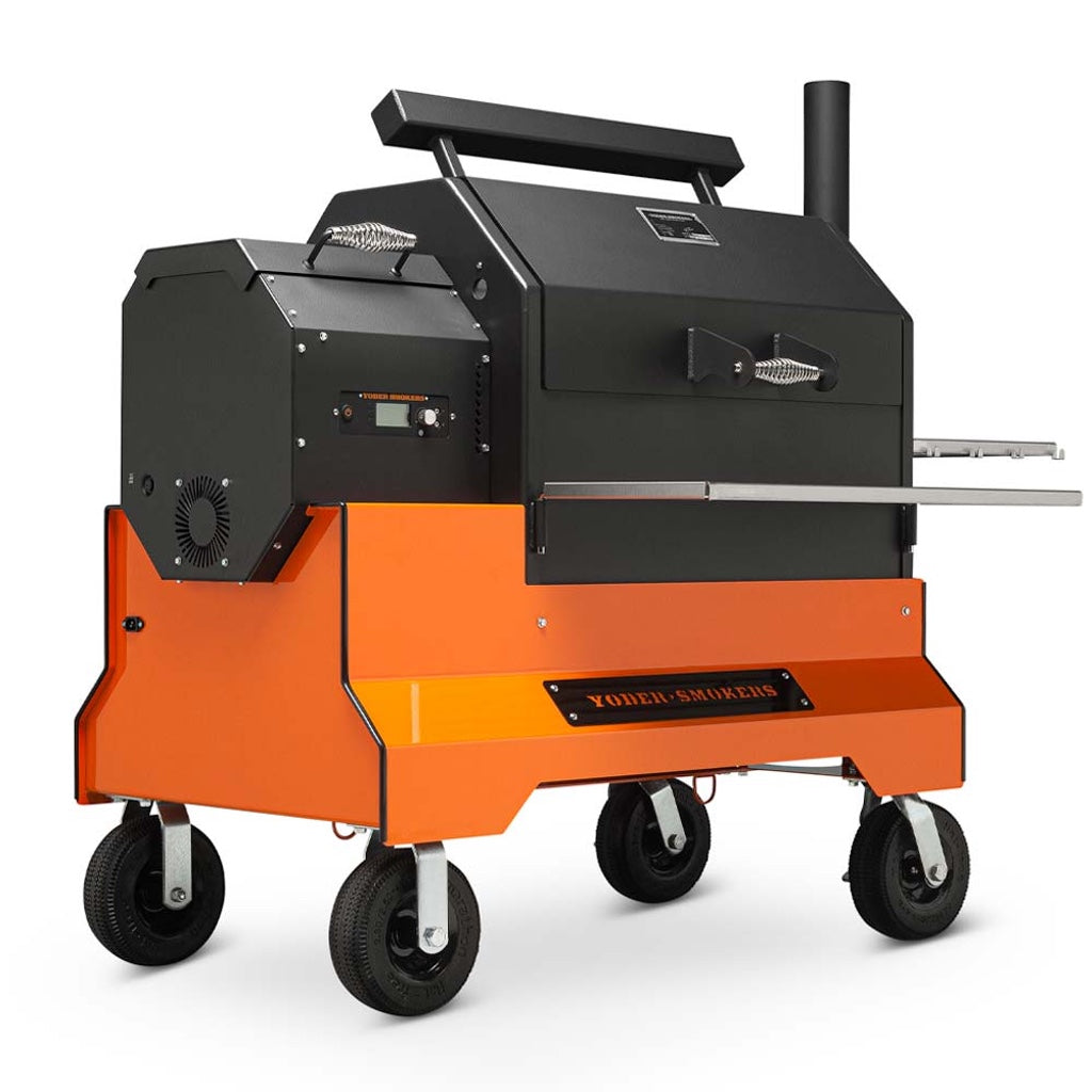 Front left view of the Yoder Smokers YS640S Pellet Grill on orange Competition Cart with pneumatic wheels.