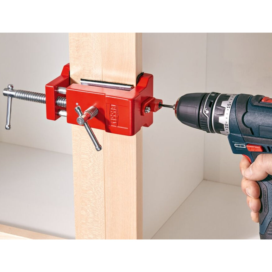 Drilling through swing-away drill bushing to connect multiple face frame cabinets