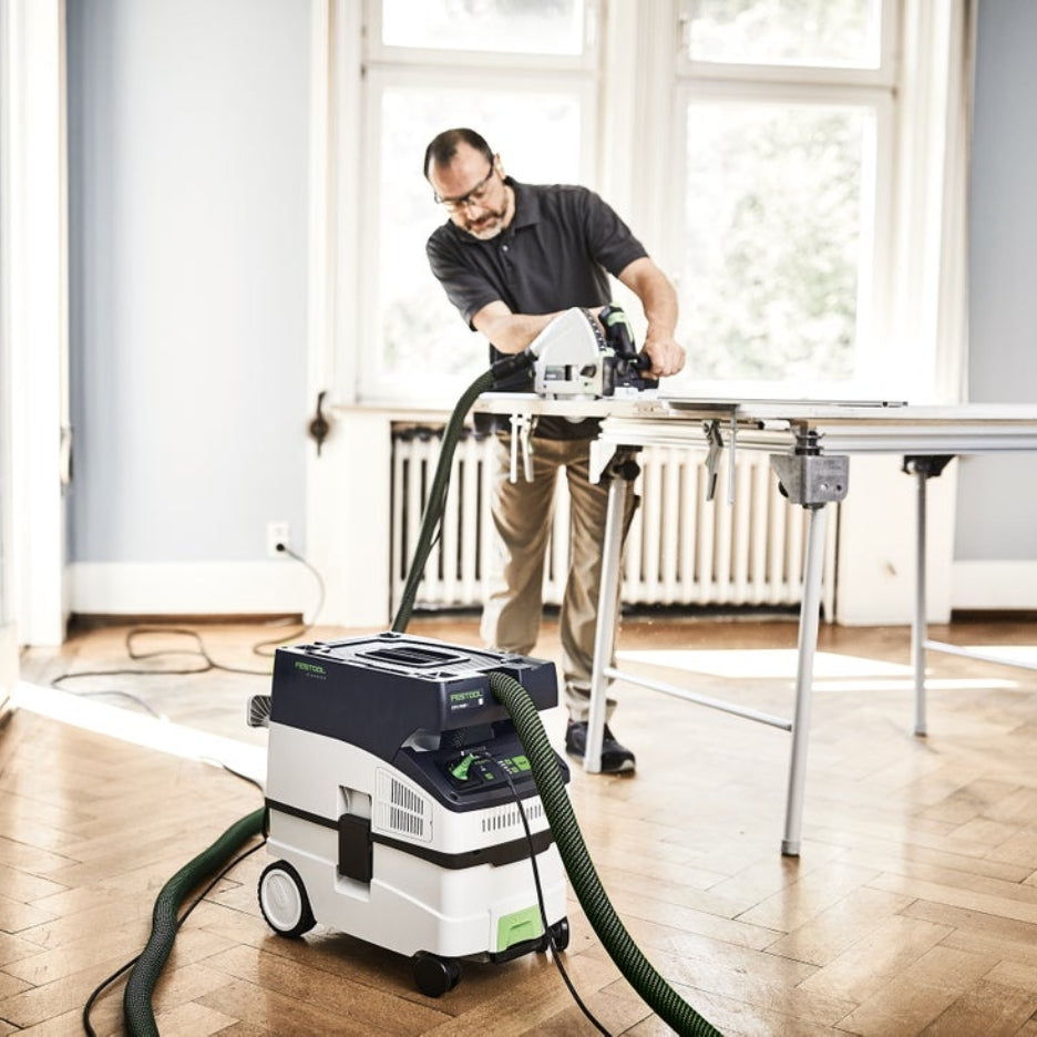 Person using a track saw attached to Festool 15 Litre Cleantec HEPA Dust Extractor with Autostart and Bluetooth CT Midi I HEPA 