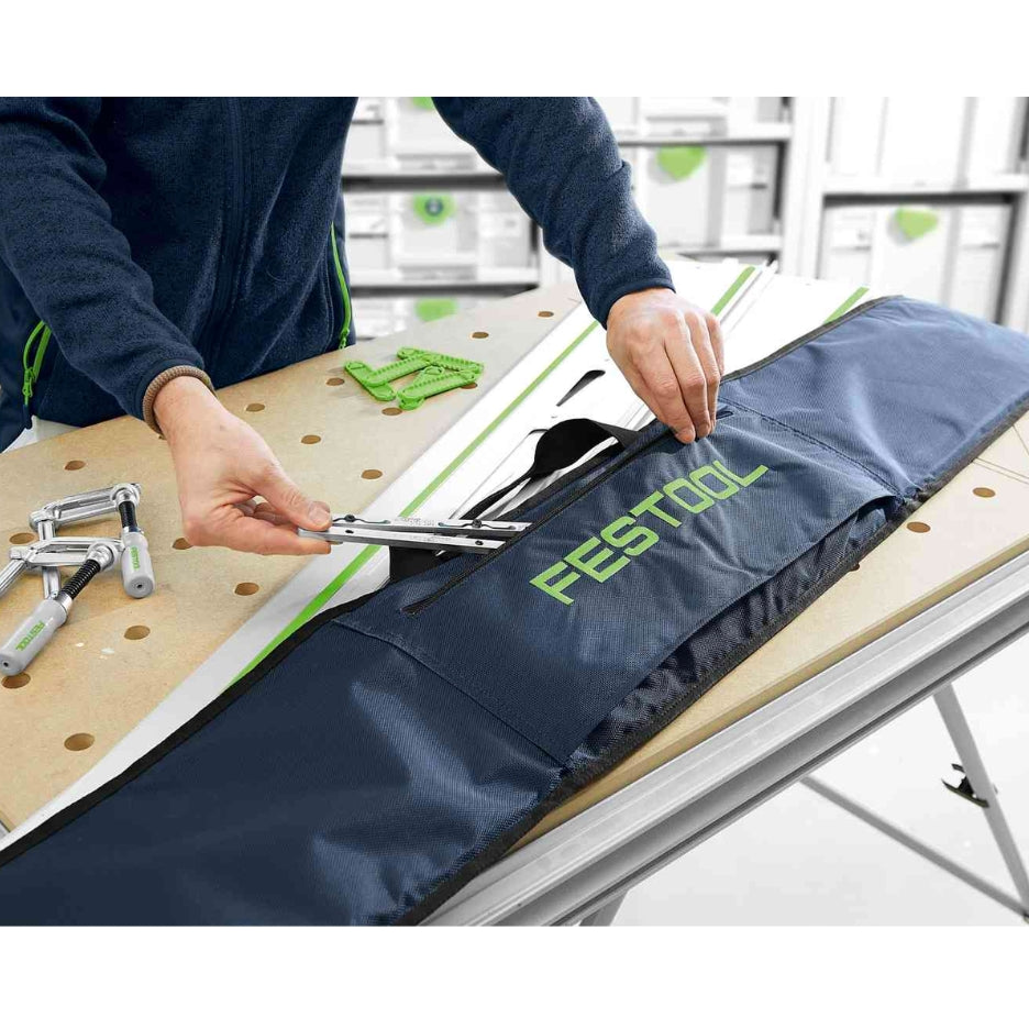 Tools being stowed on Festool 3000 mm guide rail bag's front pocket
