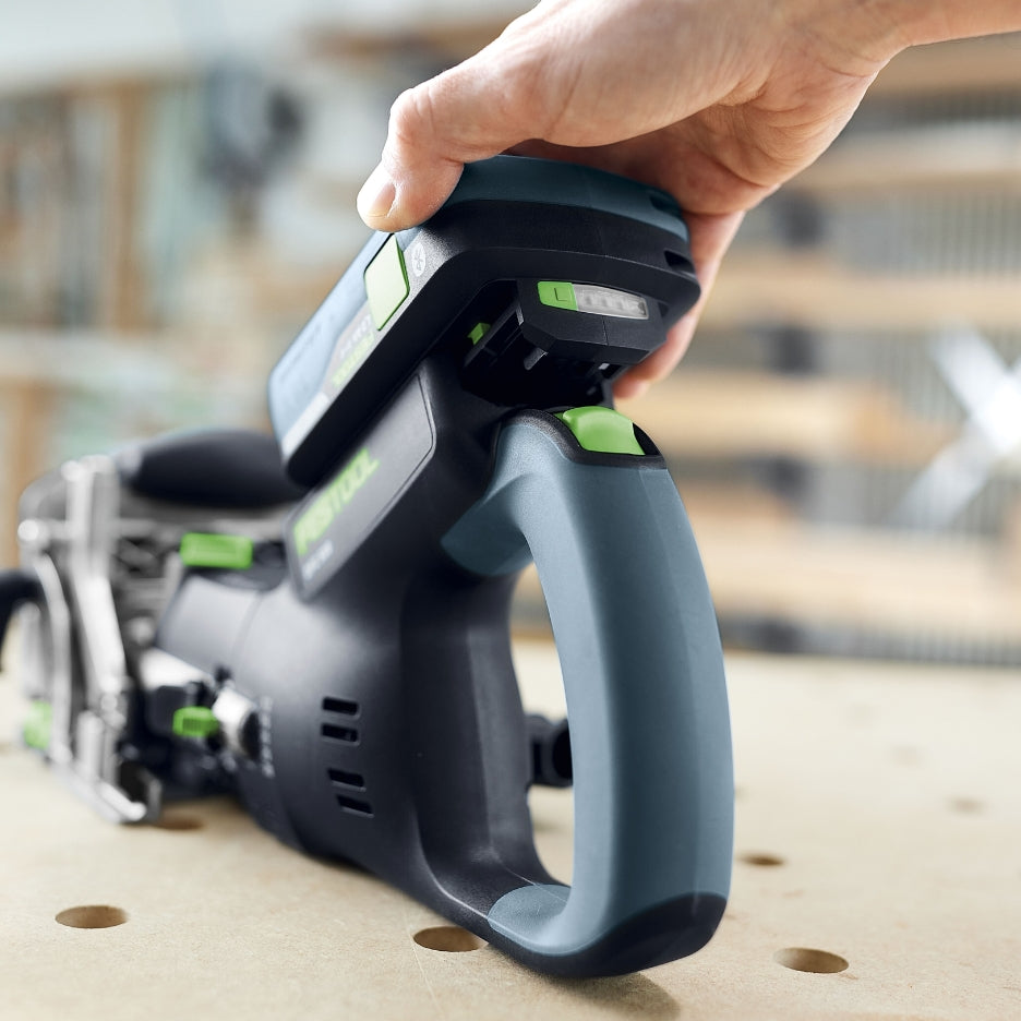 Person inserting battery on Festool Cordless Domino Joiner DFC 500