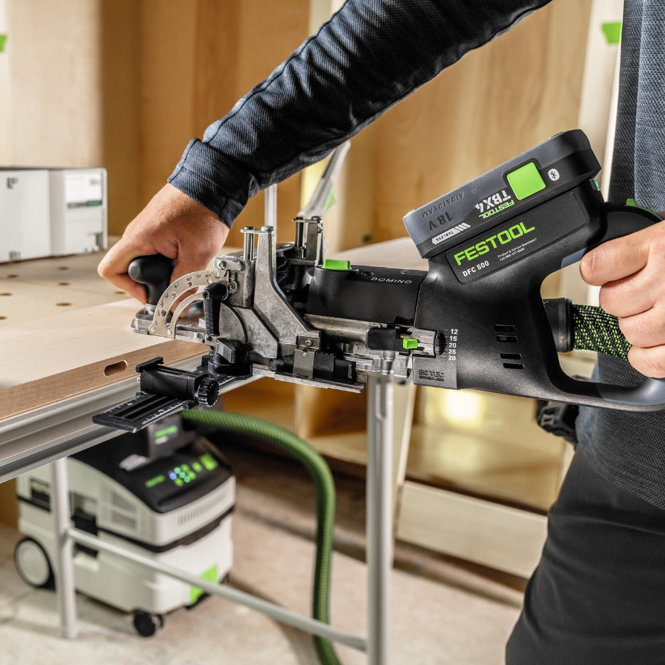 Person using Festool Cordless Domino Joiner DFC 500 for mitre joints