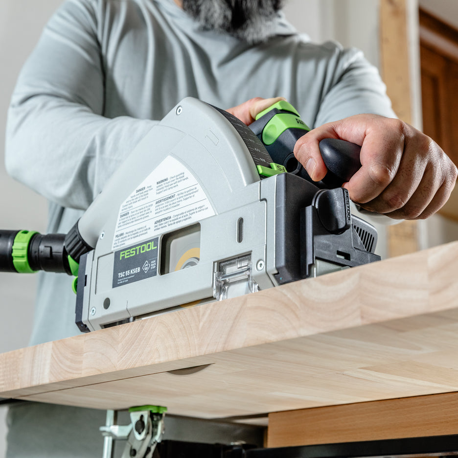 Man cuts the end of a solid hardwood counter top using Festool TSC 55 KS in one pass