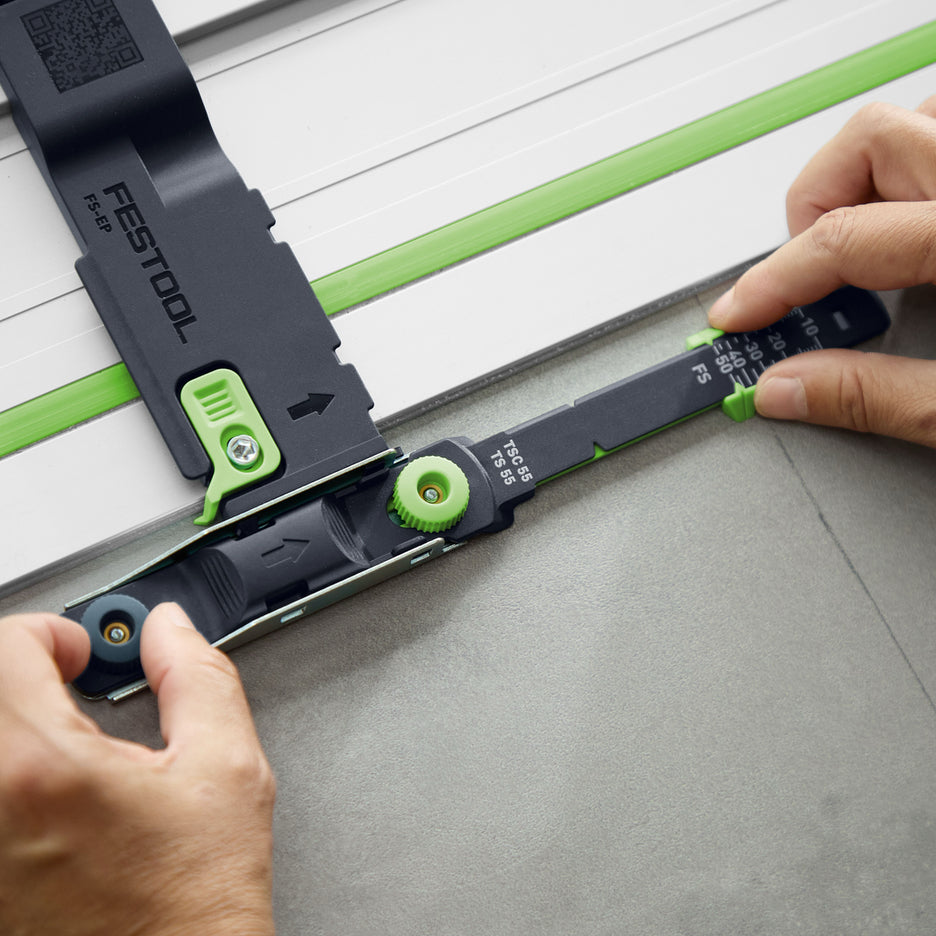 Hands adjust the blade depth indicator of the Depth Position Indicator.