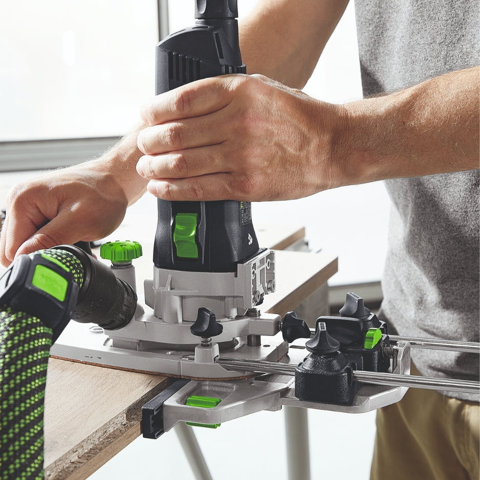 Man holding router attached to Festool Edge Guide