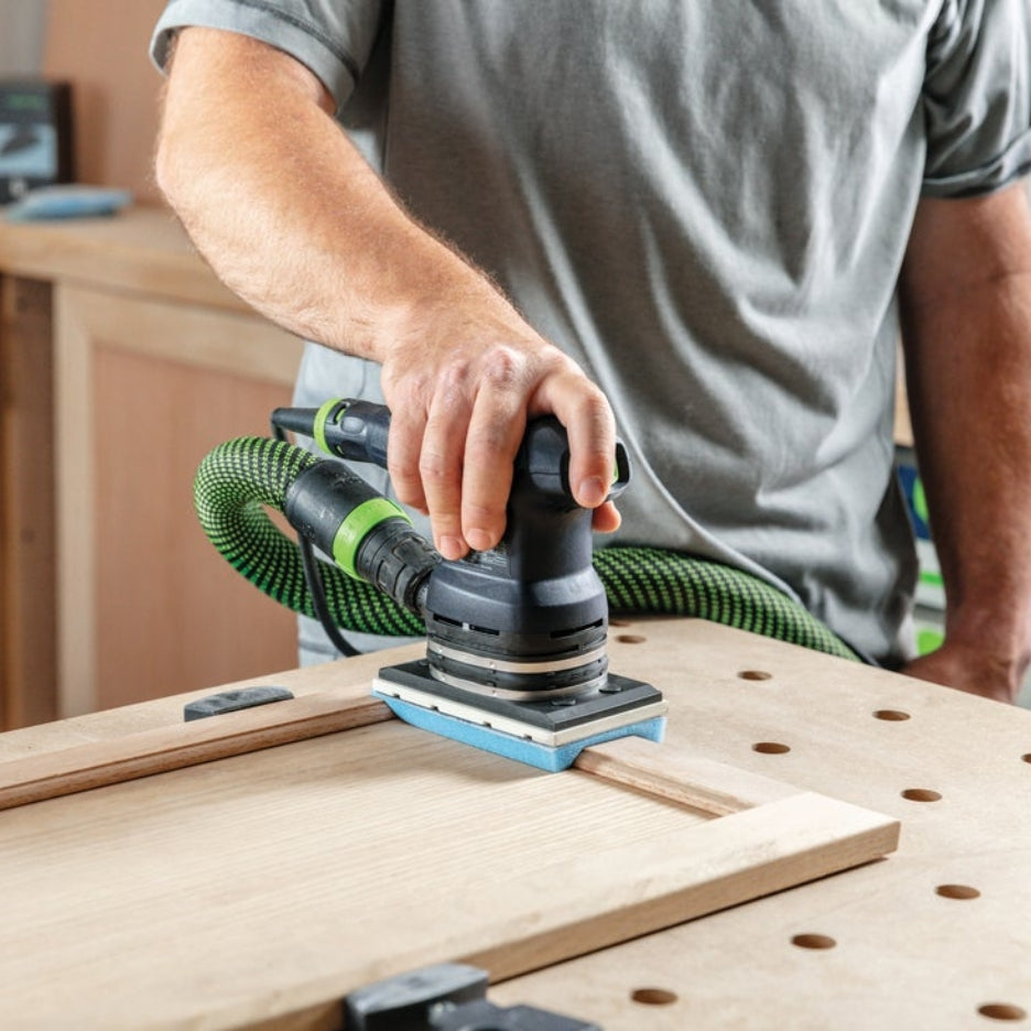Person using Festool sander with Festool Grit Abrasives Granat PROfile 80x133 M GR PRO to sand a cabinet door