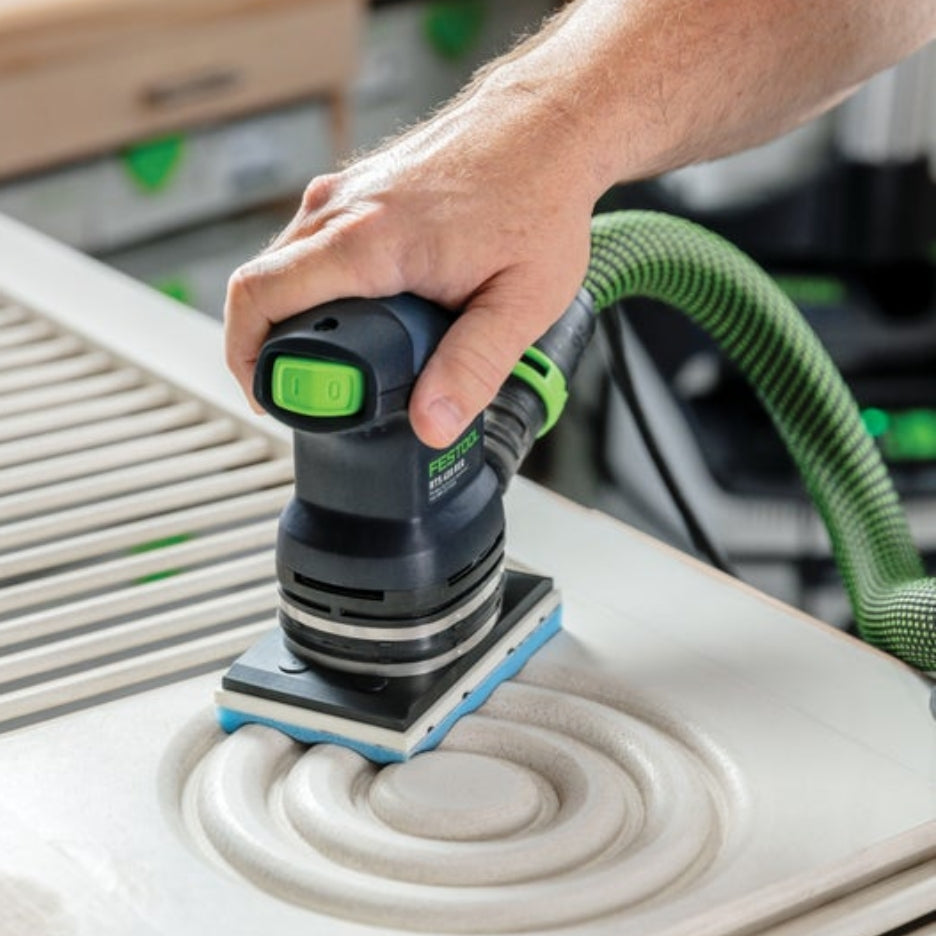 Person using Festool sander with Festool Grit Abrasives Granat PROfile 80x133 M GR PRO to sand a detail on a cabinet door