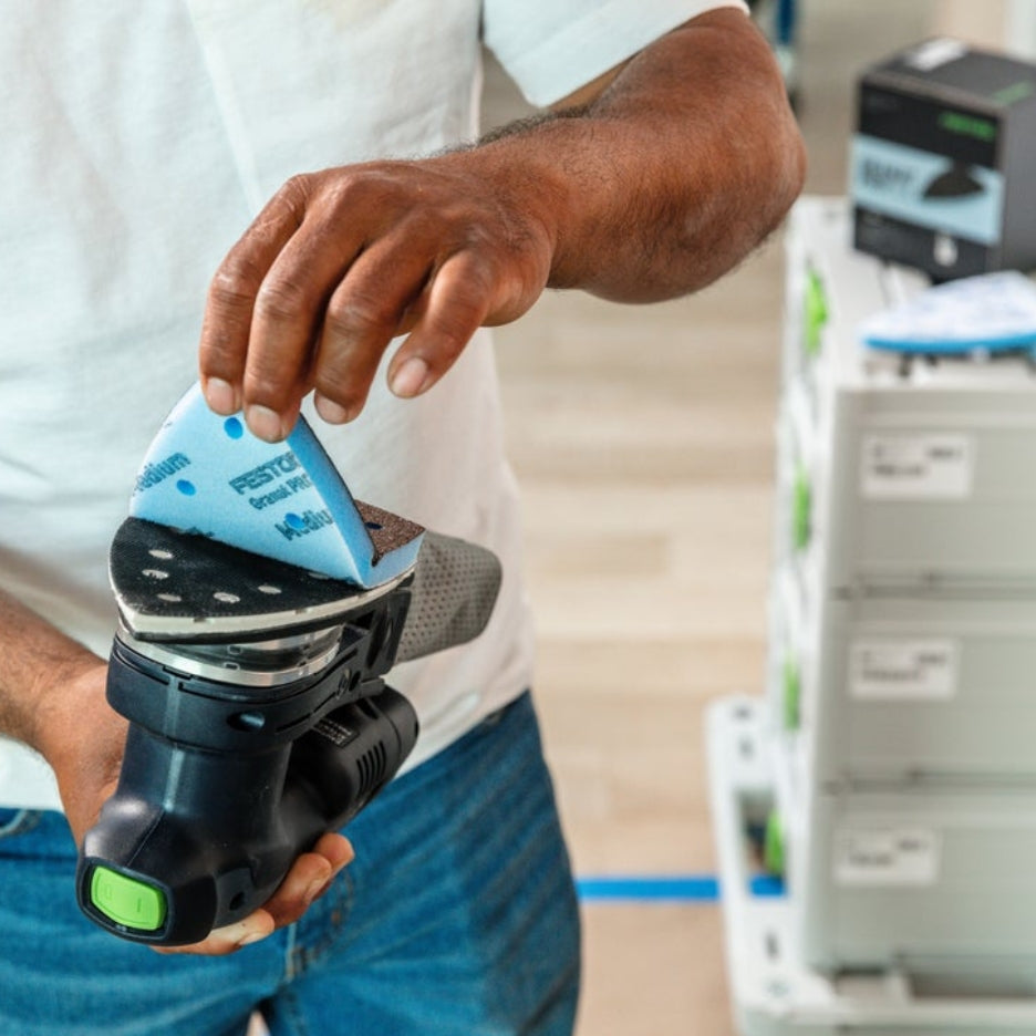 Man pulling Festool Grit Abrasives Granat PROfile Delta M GR PRO from Festool sander