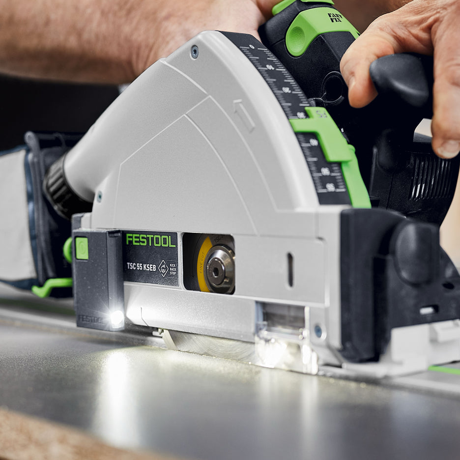 Festool LED Light Module for TS & TSC Track Saws LM-TS/TSC 578591 installed on side of Festool TS 55 KS track saw, shining on blade cutting black melamine