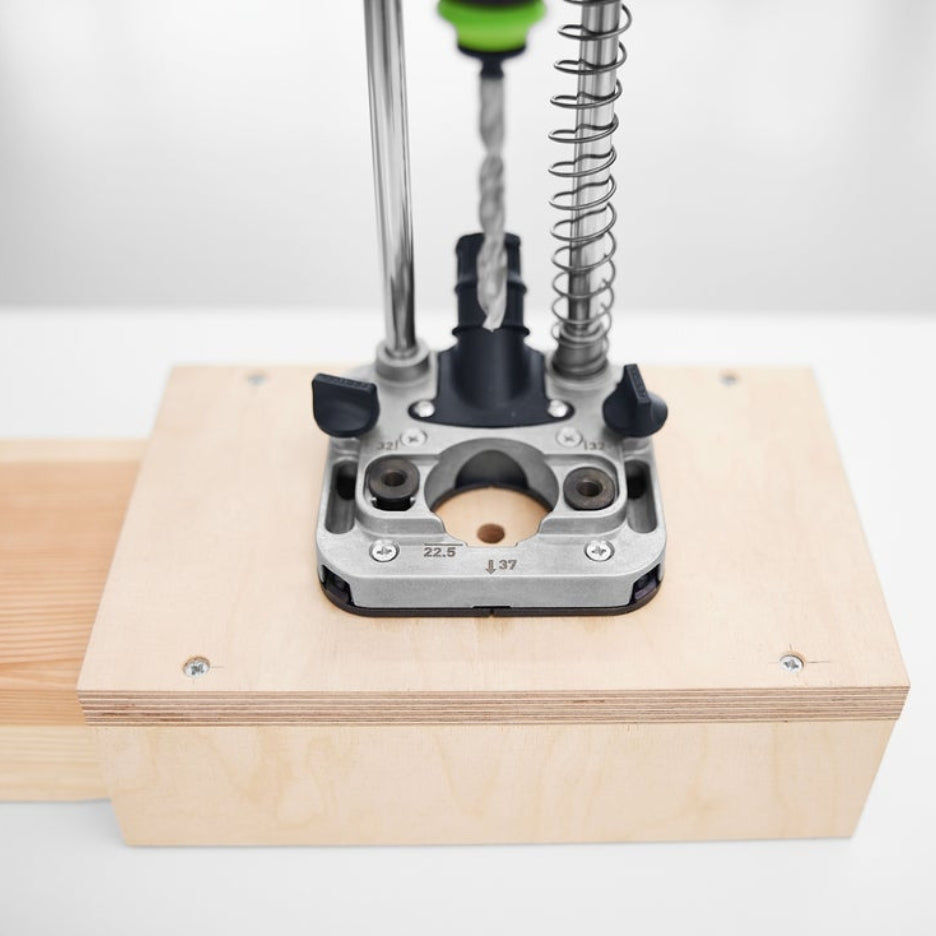 Close up view of Festool Mobile Drilling Attachment MB 40 with drill bit with custom positioning jig