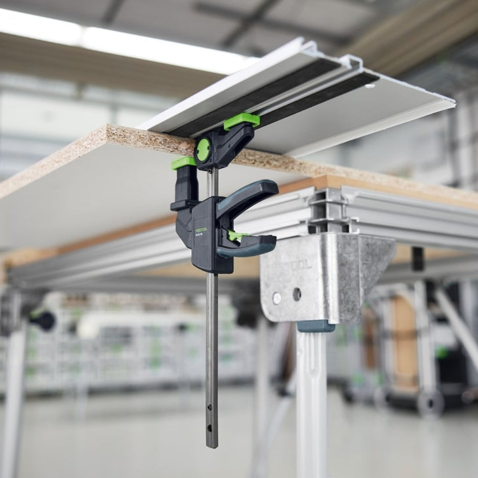 Festool One-Handed Clamp FS-EZ 150 clamping a piece of wood to a guide rail.