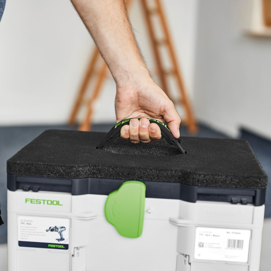 Man lifts a Systainer connected to the Seat Cushion by the seat's comfortable padded handle.