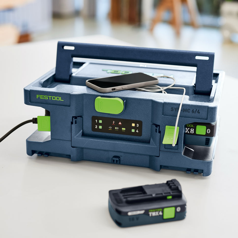 Festool Systainer Multi-Bay Rapid Charger charging Festool batteries and a mobile phone via USB-C.