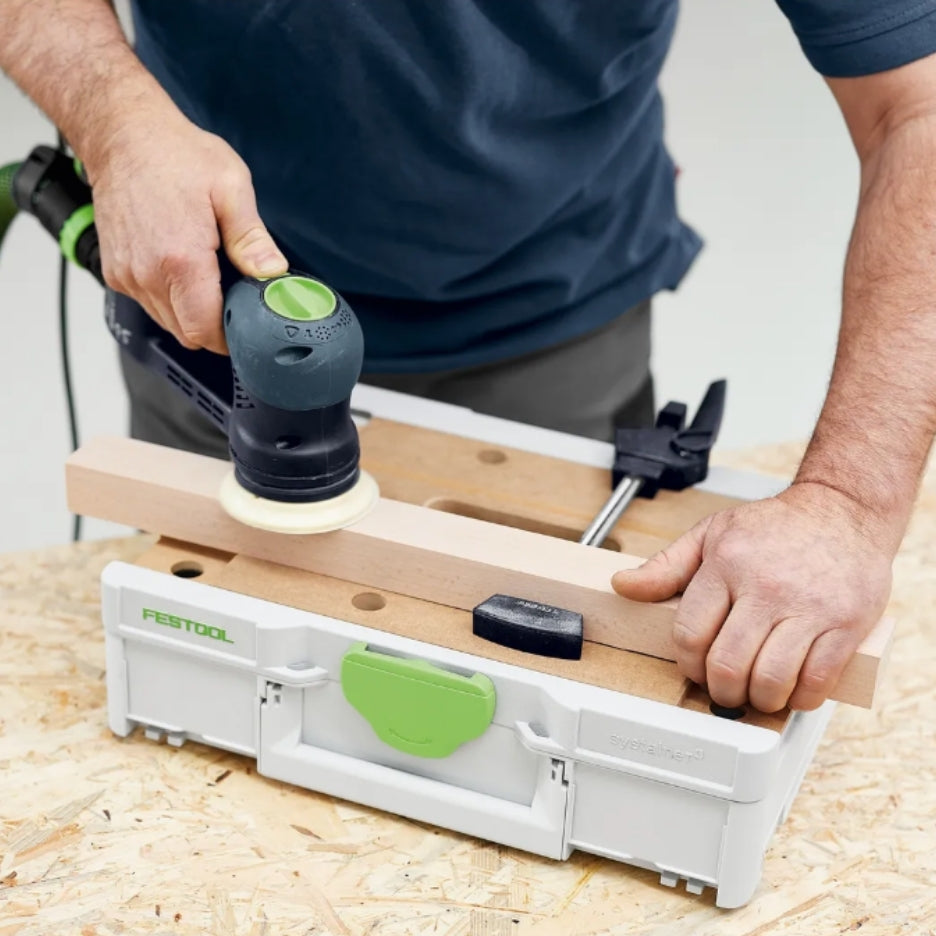 Person using a Festool sander to work on a piece of wood on top of Festool Systainer SYS3-MFT M 112
