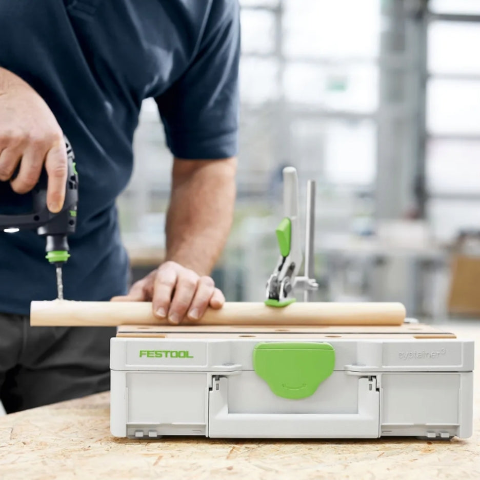 Person srilling a hole on a piece of wood on top of Festool Systainer SYS3-MFT M 112