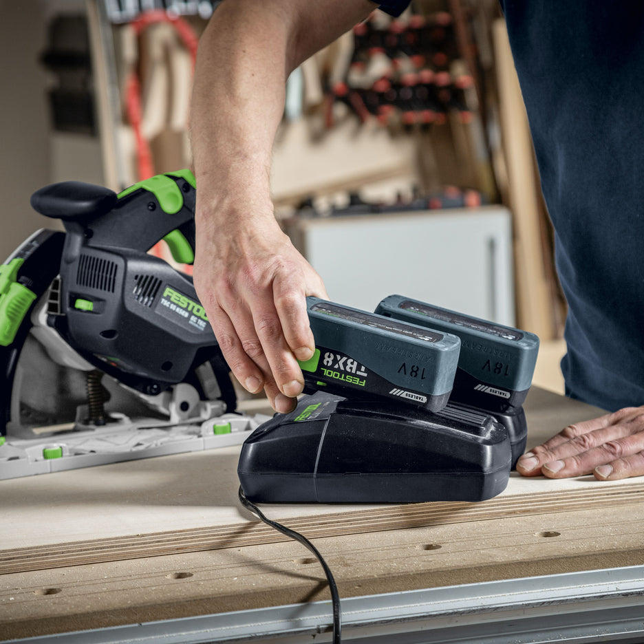 Festool TBX 8 Tabless Lithium-Ion Battery Pack being charged on dual battery charger