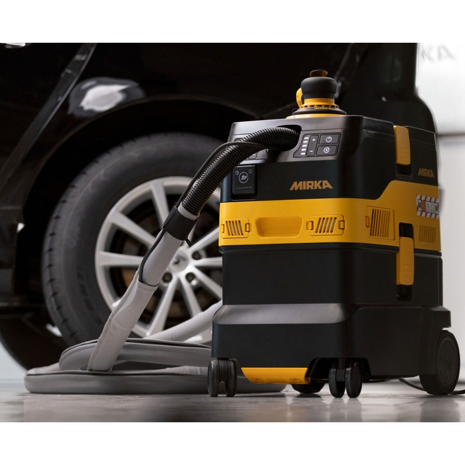 Mirka DEXOS 30 Litre Dust Extractor 1230X M HEPA AFC DE-1230X-AFC and a car on the background 