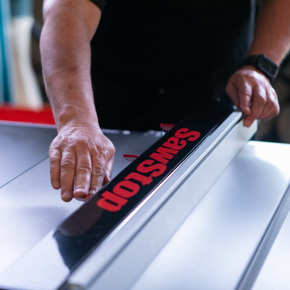 Person adjusting SawStop Professional T-Glide Advance Rip Fence