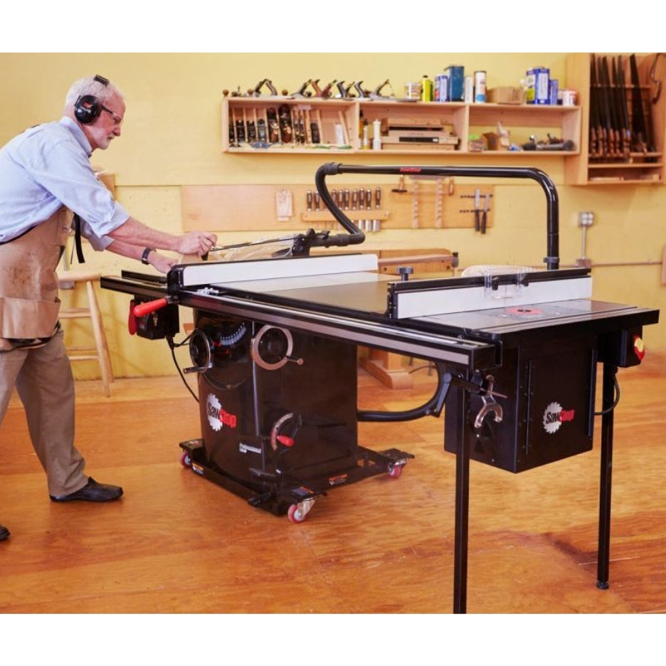 Man using SawStop Professional Cabinet Table Saw 10 Inch PCS with overarm dust collection attached