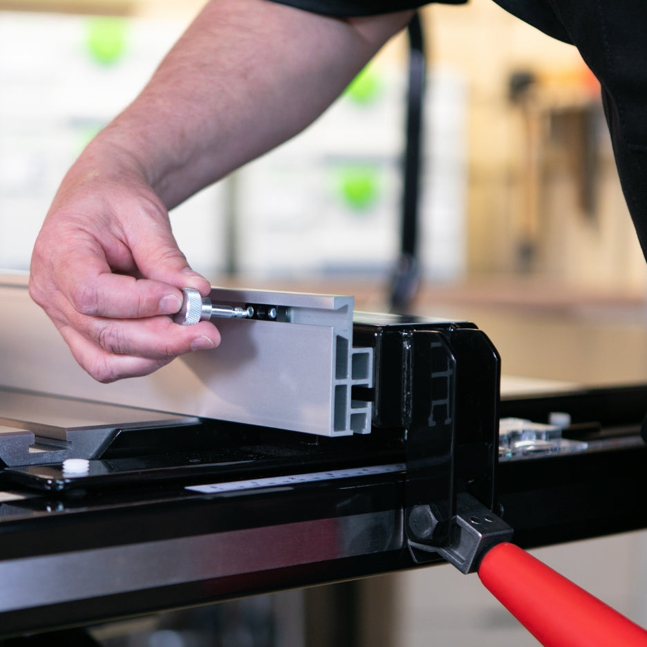 Person adjusting SawStop T-Glide Advance Rip Fence on table saw